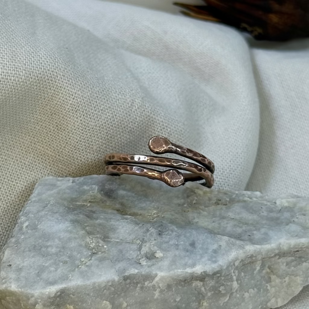 Copper ring on a stone surface with linen background