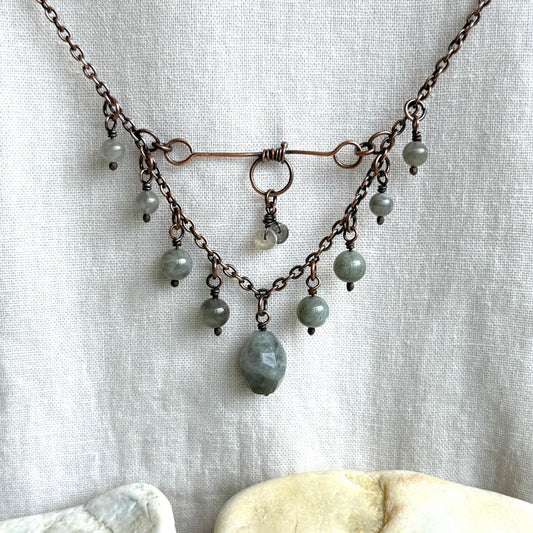 Copper Necklace with grey labradorite beads and chain on a light fabric background
