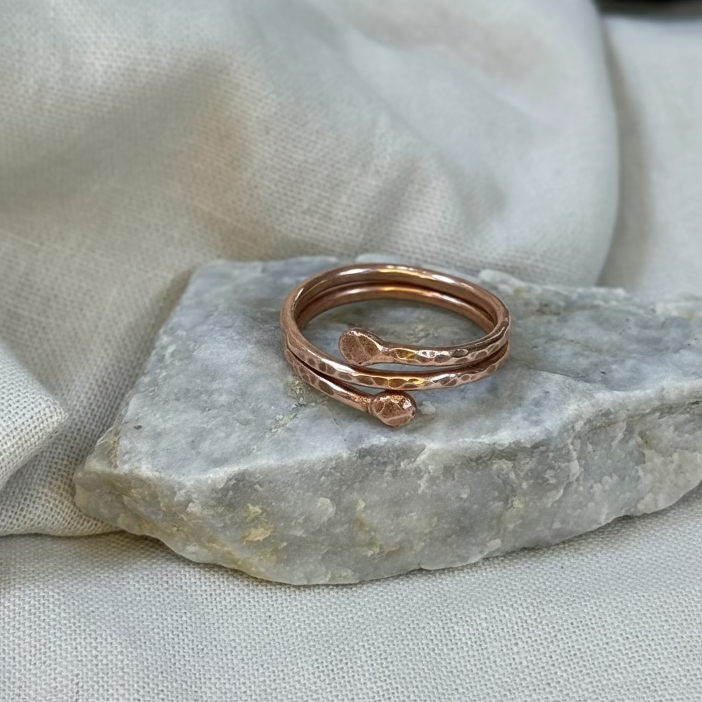 Copper ring on a stone surface with linen background