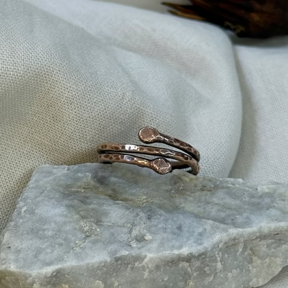 Copper ring on a stone surface with linen background