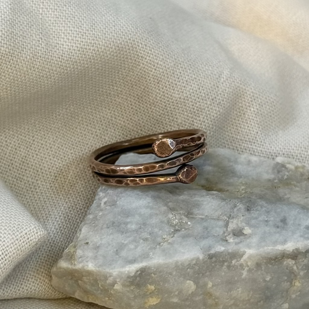 Copper ring on a stone surface with linen background