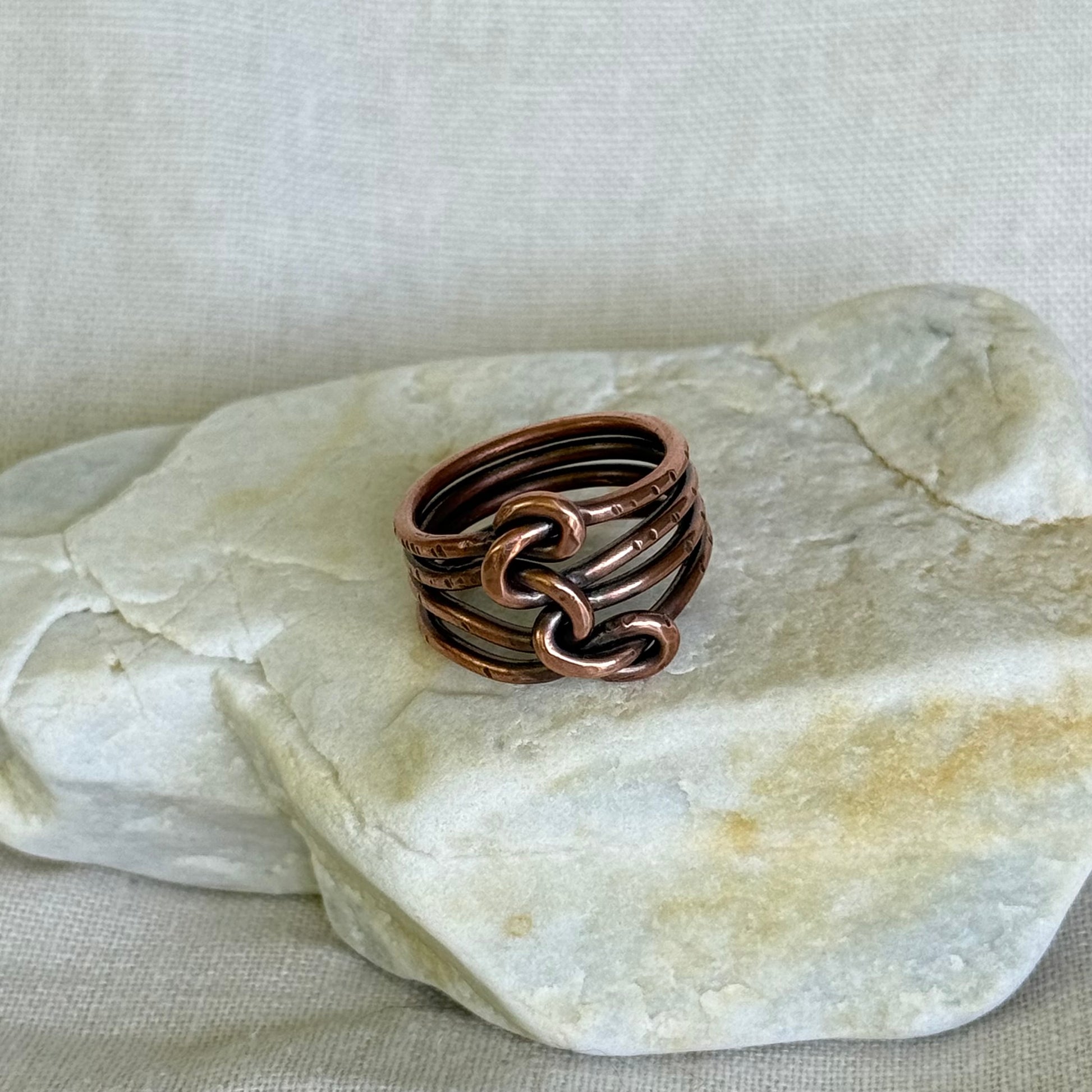 Copper ring on a stone surface